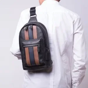 BLACKバーシティー☆COACH☆HOUSTON PACK WITH VARSITY STRIP COACH® Outlet | Houston Pack In Signature Canvas With